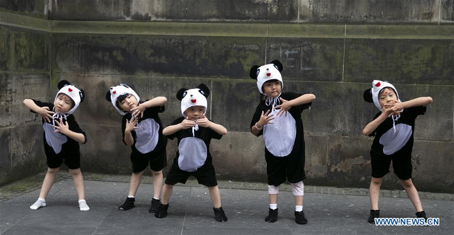 Kids from China\'s Sichuan Province perform a baby panda show on the opening day of the Edinburgh Festival Fringe 2018 in Edinburgh, Scotland, Britain on Aug. 3, 2018. (Xinhua/Han Yan)