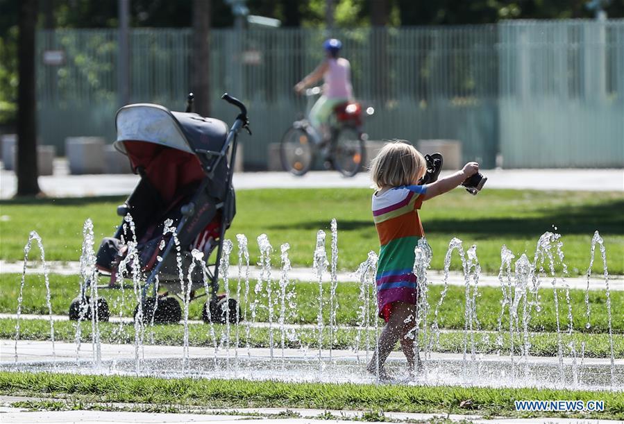 <?php echo strip_tags(addslashes(A child plays by a fountain in Berlin, capital of Germany, on Aug. 3, 2018. As Europe's scorching heat wave continues to spread across the continent, forecasters are now saying the all-time temperature record in Europe could be broken in the coming days. (Xinhua/Shan Yuqi))) ?>