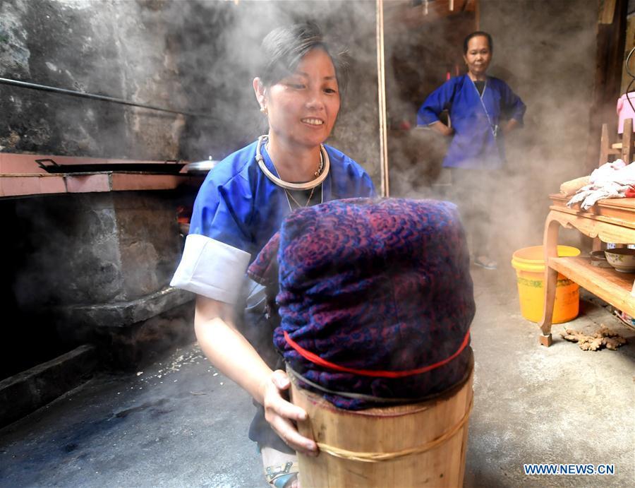 <?php echo strip_tags(addslashes(Women of the Dong ethnic group steam dyed Dong cloth at Linxi Village of Sanjiang Dong Autonomous County under Liuzhou City, south China's Guangxi Zhuang Autonomous Region, Aug. 4, 2018. Summer is the best season for the people of the Dong ethnic group to make their traditional Dong cloth in ancient ways with natural materials. It is popular among the Dong people for its shining look in the sun and cozy quality for wearing. (Xinhua/Li Hanchi))) ?>