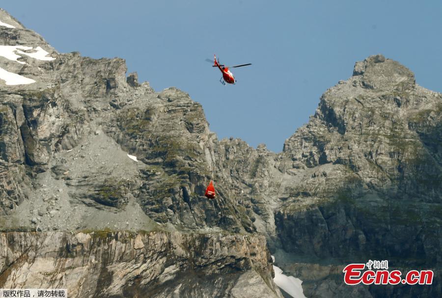 <?php echo strip_tags(addslashes(A helicopter flies to the accident site of a Junkers Ju-52 airplane of local airline JU-AIR at 2,450 meters above sea level near the mountain resort of Flims, Switzerland August 5, 2018. (Photo/Agencies))) ?>