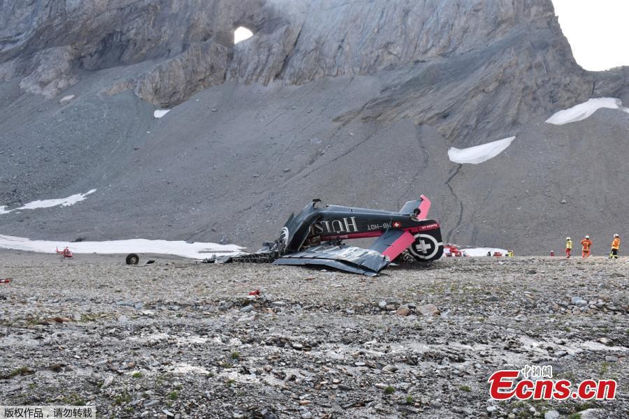 Accident investigators and rescue personnel work at the wreckage of a Junkers JU52 aircraft in Flims on August 5, 2018, after it crashed into Piz Segnas, a peak in eastern Switzerland on August 4. Twenty people are confirmed dead after a vintage World War II aircraft crashed into a Swiss mountainside, police reports said. The Junker JU52 HB-HOT aircraft, built in Germany in 1939 and now a collector’s item, belongs to JU-Air, a company with links to the Swiss air force, the ATS news agency reported. (Photo/VCG)