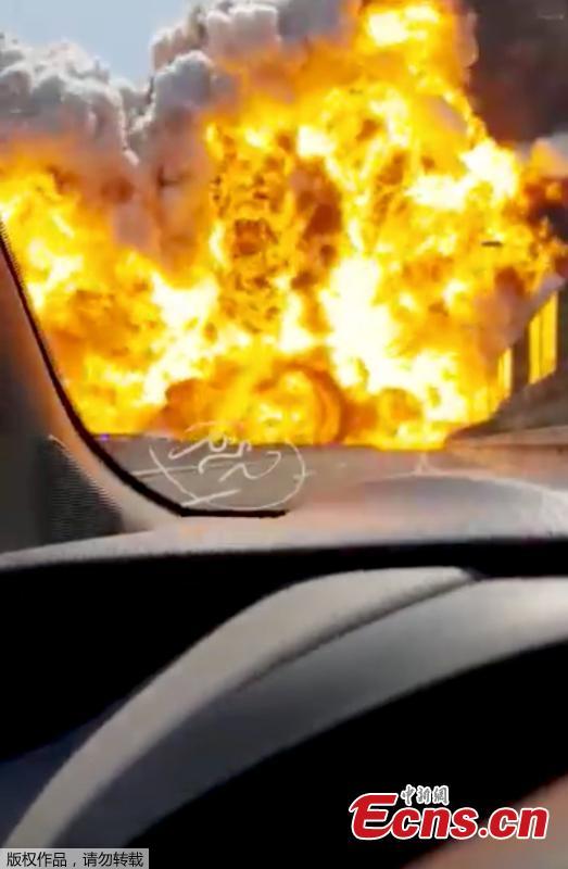 This frame grab taken from a video shows the moment a truck that was transporting flammable substances explodes after colliding with another truck on a highway in the outskirts of Bologna, Italy, Aug. 6, 2018. The explosion killed at least two people and injured up to 70 as a section of the thoroughfare collapsed, police said. (Photo/Agencies)