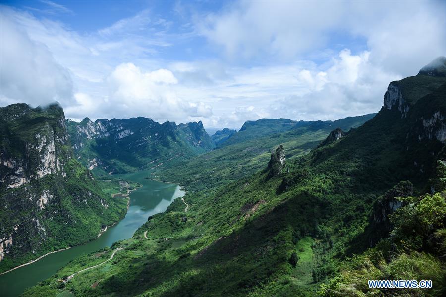 <?php echo strip_tags(addslashes(Photo taken on Aug. 7, 2018 shows the scenery of Beipanjiang river valley in Zhenfeng County, southwest China's Guizhou Province. (Xinhua/Tao Liang))) ?>