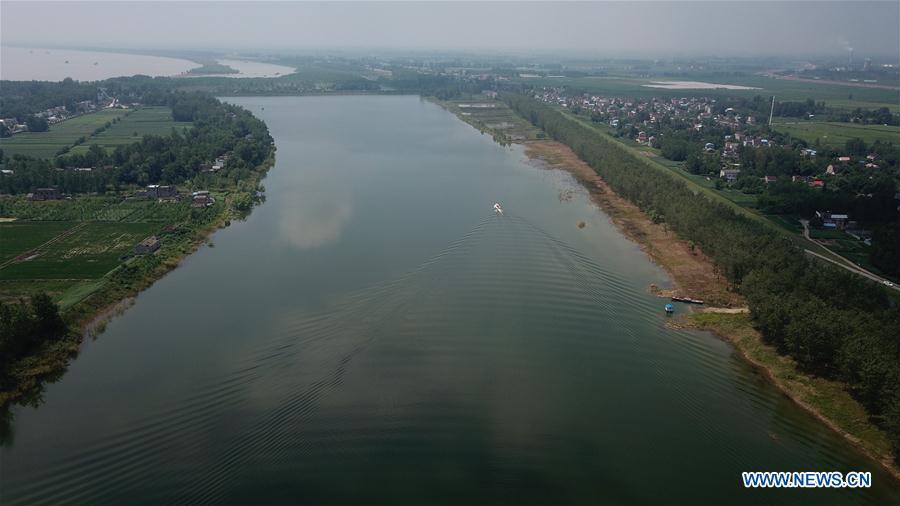 <?php echo strip_tags(addslashes(Aerial photo taken on Aug. 7, 2018 shows a fishery administration ship sailing on the Xijiang section of the finless porpoise nature reserve along the Yangtze River in Anqing City, east China's Anhui Province. The finless porpoise nature reserve, consisting of three core zones, six buffer zones and several experimental zones, has provided a safe habitat for some 200 finless porpoises, since being set up in 2017. (Xinhua/Jin Liwang))) ?>