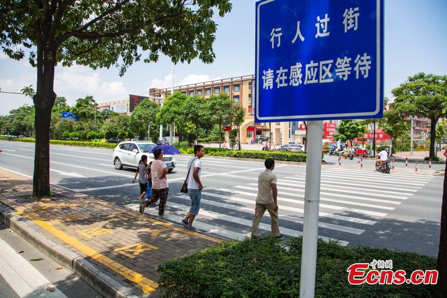 <?php echo strip_tags(addslashes(A smart zebra crossing is put into use in Nanning City, South China’s Guangxi Zhuang Autonomous Region, Aug. 8, 2018. When at least three pedestrians wait near the first smart zebra cross in Guangxi, the duration of green light signal for vehicles will automatically reduces from 120 seconds to 65 seconds, giving priority to pedestrians. (Photo: China News Service/Chen Guanyan))) ?>