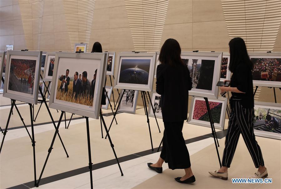 People visit the photo exhibition \