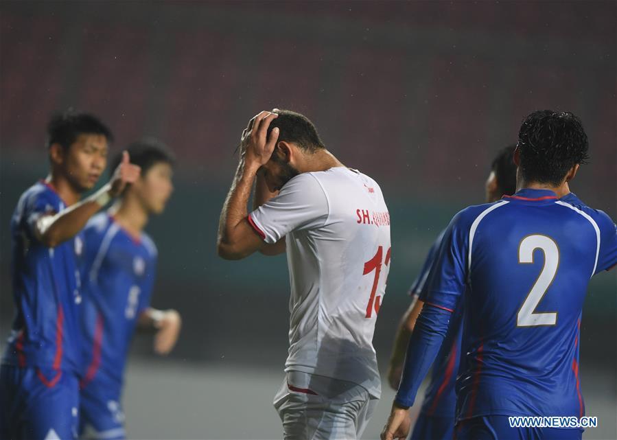 Shehab Qumbor (C) of Palestine reacts during the Men\'s Football Group A match between Chinese Taipei and Palestine at the 18th Asian Games at Patriot Stadium in Bekasi, Indonesia, Aug. 10, 2018. (Xinhua/Jia Yuchen)