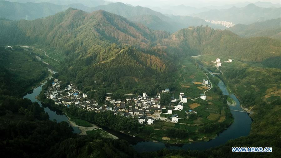 <?php echo strip_tags(addslashes(Aerial photo taken on Aug. 10, 2018 shows scenery at dawn in Shitan Village, Shexian County, east China's Anhui Province. (Xinhua/Zhang Duan))) ?>