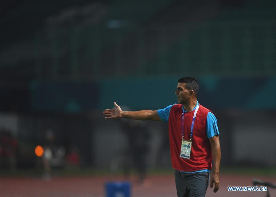 <?php echo strip_tags(addslashes(Ayman Sandouqa, head coach of Palestine, reacts during the Men's Football Group A match between Chinese Taipei and Palestine at the 18th Asian Games at Patriot Stadium in Bekasi, Indonesia, Aug. 10, 2018. (Xinhua/Jia Yuchen))) ?>