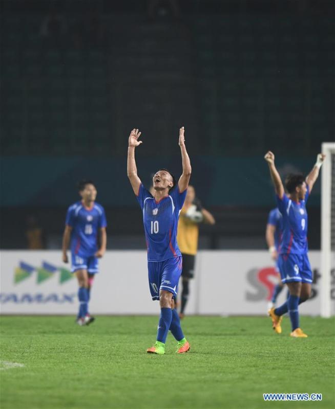 <?php echo strip_tags(addslashes(Chen Chaoan (C) of Chinese Taipei celebrates after the Men's Football Group A match between Chinese Taipei and Palestine at the 18th Asian Games at Patriot Stadium in Bekasi, Indonesia, Aug. 10, 2018. The match ended with a 0-0 draw. (Xinhua/Jia Yuchen))) ?>