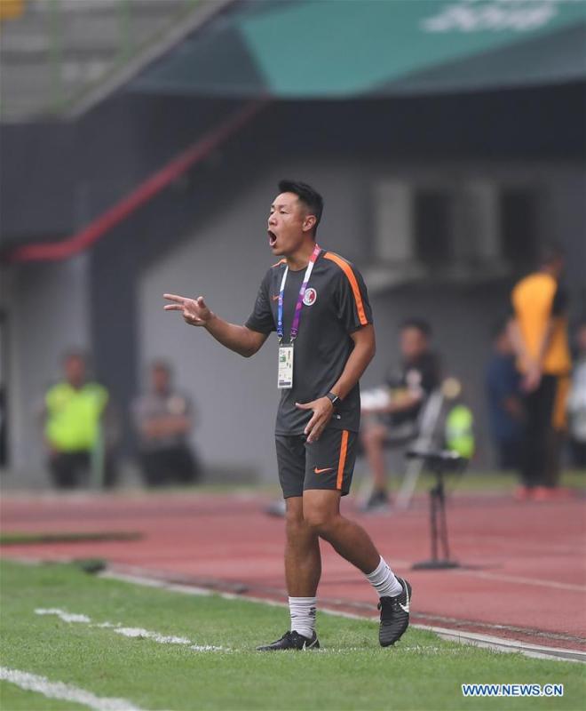 Kwok Kar Lok Kenneth, head coach of Hong Kong of China, reacts during the Men\'s Football Group A match between Kwok Kar Lok Kenneth and Laos at the 18th Asian Games at Patriot Stadium in Bekasi, Indonesia, Aug. 10, 2018. (Xinhua/Jia Yuchen)