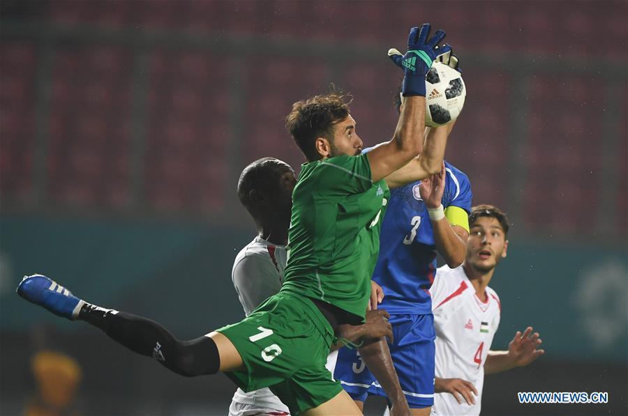 <?php echo strip_tags(addslashes(Rami Hamada (Front), goalkeeper of Palestine saves the ball during the Men's Football Group A match between Chinese Taipei and Palestine at the 18th Asian Games at Patriot Stadium in Bekasi, Indonesia, Aug. 10, 2018. The match ended with a 0-0 draw. (Xinhua/Jia Yuchen))) ?>