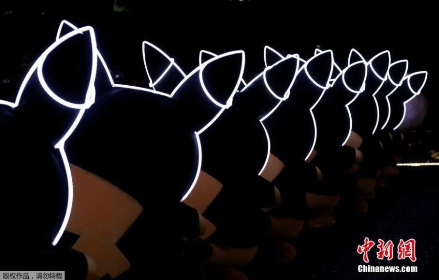 Performers wearing Pokemon\'s character Pikachu costumes take part in a night parade in Yokohama, Japan August 10, 2018. A total of over 1,500 Pikachus (in both frolicking and decorative forms) will be greeting visitors to Yokohama’s Minato Mirai harbor district. (Photo/Agencies)