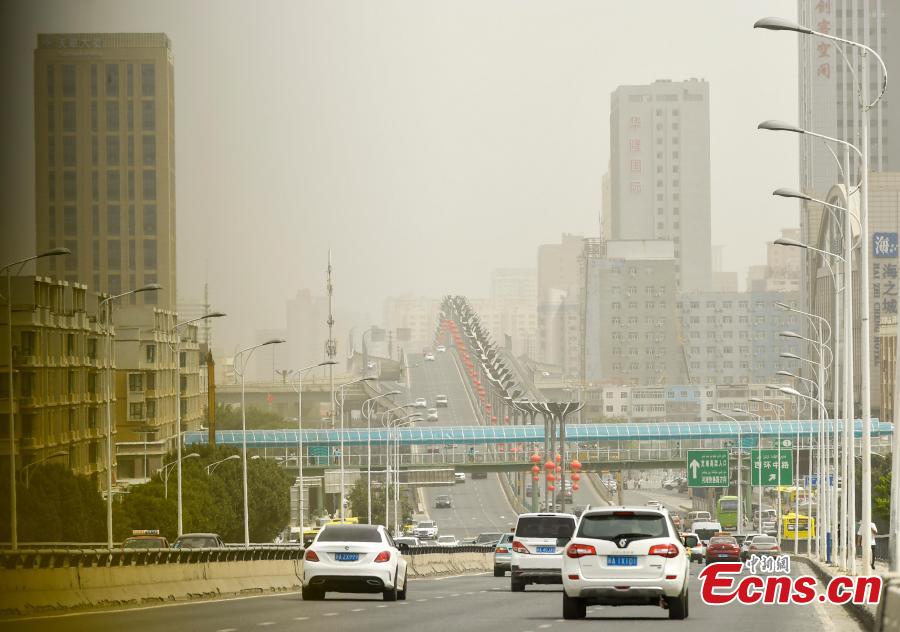 <?php echo strip_tags(addslashes(A sandstorm hits Urumqi, capital of Northwest China’s Xinjiang Uygur Autonomous Region, Aug. 12, 2018. Visibility was reduced as dust shrouded the city, where temperatures reached approximately 35 degrees centigrade. (Photo: China News Service/Liu Xin))) ?>