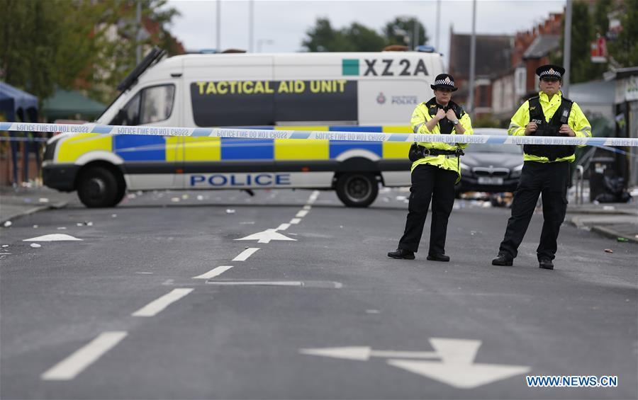 Policemen form a cordon at the scene of the mass shooting occurring in the Moss Side area, Manchester, Britain, Aug. 12, 2018. A mass shooting in the British city of Manchester wounded 10 people Sunday morning, local authorities said. (Xinhua/Ed Sykes)