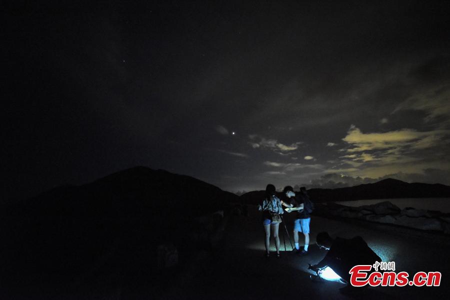 <?php echo strip_tags(addslashes(Visitors watch the Perseid meteor shower near the High Island Reservoir, where there’s little light pollution, in Hong Kong, August 13, 2018. (Photo: China News Service/ Sheung Man Mak))) ?>