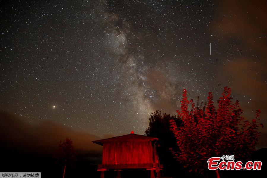 <?php echo strip_tags(addslashes(A meteor streaks past stars and the Milky Way in the night sky during the Perseids meteor shower in Berducedo, Spain, August 12, 2018. (Photo/Agencies))) ?>