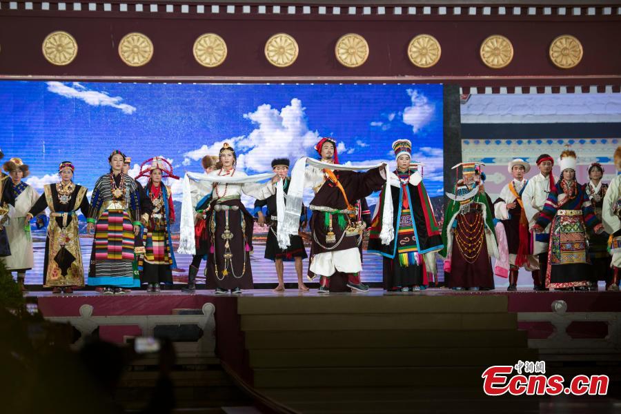 Models present outfits during a fashion show in Lhasa, Tibet Autonomous Region, Aug. 12, 2018. Models presented 84 designs including 26 traditional Tibetan costumes in the fashion show organized by Tibet Vocational Technical College and the Beijing Institute of Fashion Technology. (Photo/Xinhua)