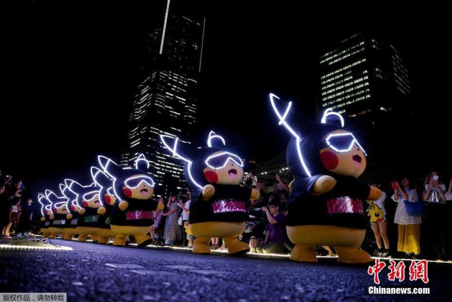 Performers wearing Pokemon\'s character Pikachu costumes take part in a night parade in Yokohama, Japan August 10, 2018. A total of over 1,500 Pikachus (in both frolicking and decorative forms) will be greeting visitors to Yokohama’s Minato Mirai harbor district. (Photo/Agencies)
