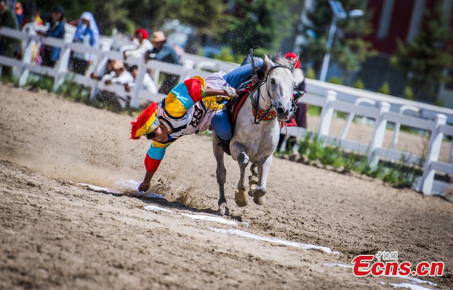 <?php echo strip_tags(addslashes(An equestrian puts on a display of traditional horsemanship skills during the Shoton Festival, commonly known as the Yogurt Festival, in Lhasa, Southwest China’s Tibet Autonomous Region, Aug. 13, 2018. Equestrians performed ten kinds of stunts while riding a horse, including archery and toasting. (Photo: China News Service/He Penglei))) ?>