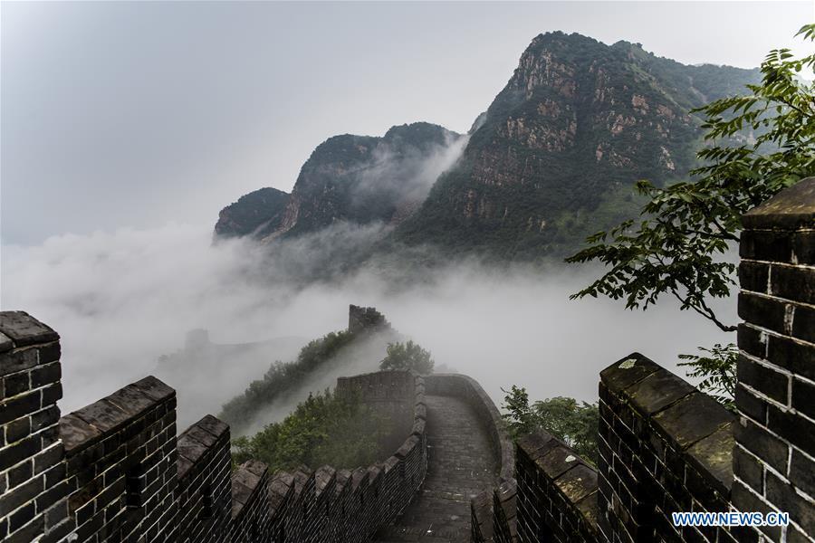 Photo taken on Aug. 13, 2018 shows cloud and fog after a rainfall at Huangyaguan section of the Great Wall in the Jizhou District of Tianjin, north China. (Xinhua/Wang Guangshan)