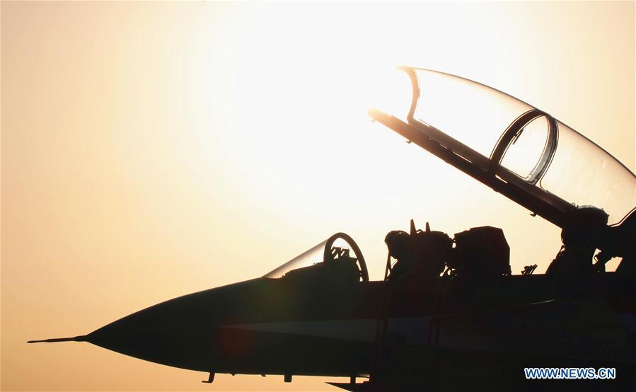 A J-10 fighter jet of the Chinese People\'s Liberation Army (PLA) Air Force\'s August 1st aerobatics team is seen at an airport in northwest China\'s Xinjiang Uygur Autonomous Region, Aug. 16, 2018. The August 1st team left Thursday for Russia to perform at the Army 2018 International Military and Technical Forum. (Xinhua/Yu Yongde)