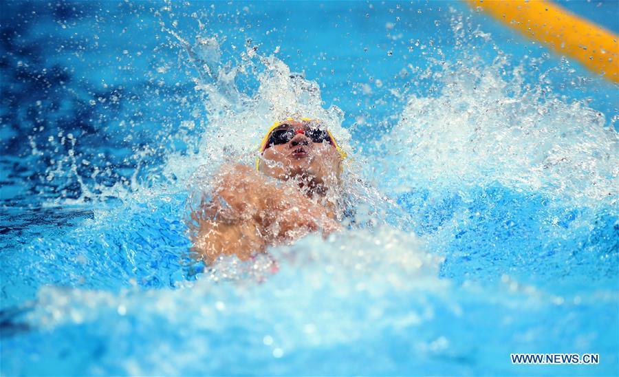 Xu Jiayu of China competes during men\'s 100m backstroke final in the 18th Asian Games in Jakarta, Indonesia, Aug。 19, 2018. (Photo/Xinhua)