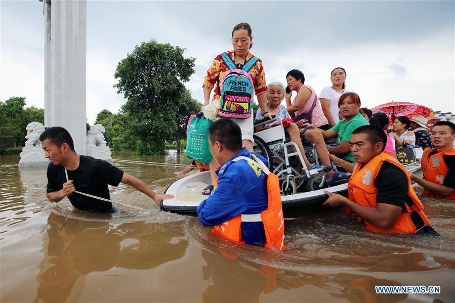 <?php echo strip_tags(addslashes(Rescuers transfer the flood-stranded people in Huaibei City, east China's Anhui Province, Aug. 19, 2018. Typhoon Rumbia has brought heavy rain to Huaibei and some places in Huaibei were inundated by flood. (Xinhua/Wan Shanchao))) ?>