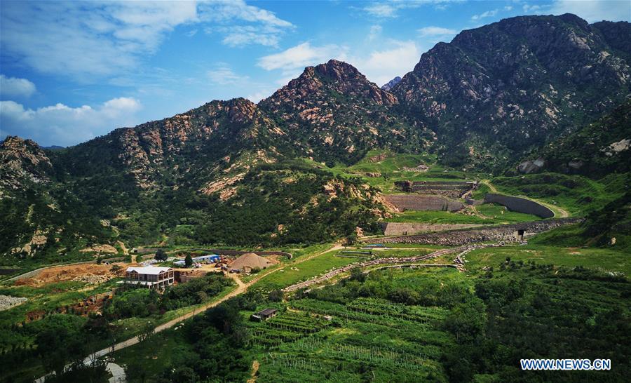 Aerial photo taken on Aug. 18, 2018 shows a park constructed on the site of an abandoned mine in Changli County, north China\'s Hebei Province. The discarded mine and damaged mountain revive as the local government has been stepping up measures to rehabilitate the ecological environment. (Xinhua/Yang Shiyao)