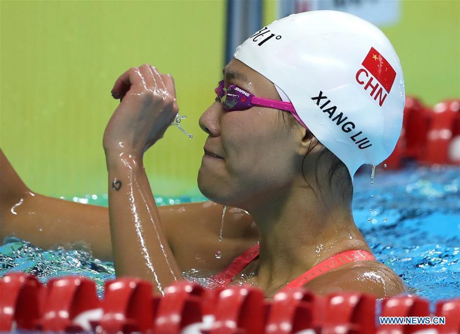 Liu Xiang of China celebrates after women\'s 50m backstroke final of swimming at the 18th Asian Games in Jakarta, Indonesia, Aug. 21, 2018. Liu won the gold with 26.98 seconds and set a new world record. (Xinhua/Fei Maohua)