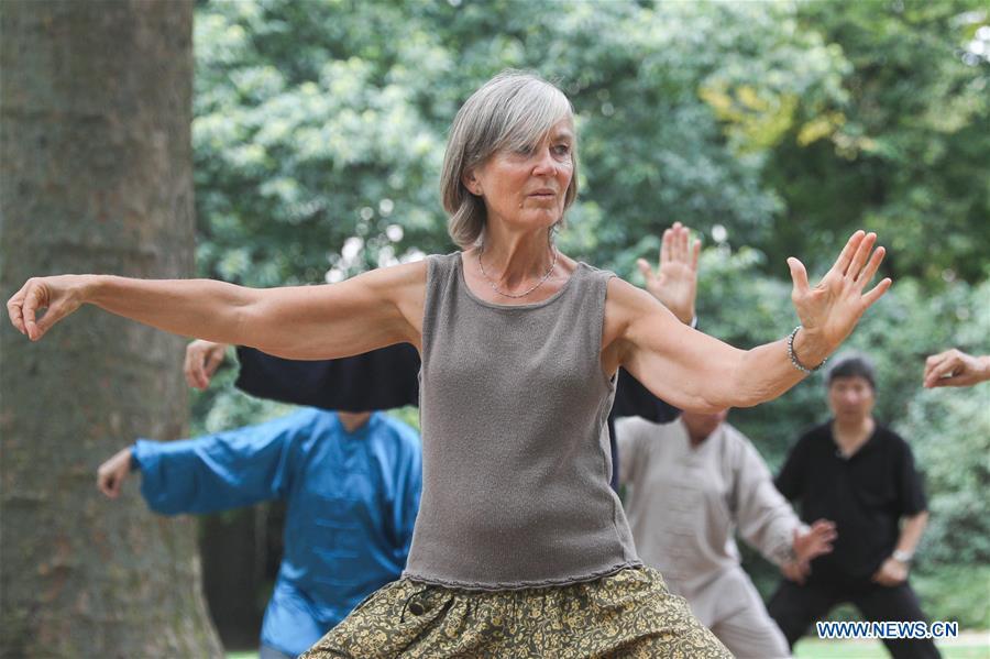 <?php echo strip_tags(addslashes(People learn Tai Chi at the Cinquantenaire park in Brussels, Belgium, Aug. 21, 2018. Every Tuesday and Friday afternoon, free Chinese Tai Chi class is held here and it attracts many local residents in Brussels. (Xinhua/Zheng Huansong))) ?>