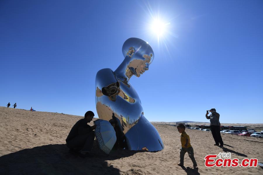 Twenty-six sculptures collected from around the world are on show in a desert in Minqin County, Northwest China’s Gansu Province, Aug. 22, 2018. The sculptures have been made from varying materials, including stainless steel, cast iron, stone and cement, and they reveal the ever-present nature of sand and its control in the county. (Photo: China News Service/Yang Yanmin)