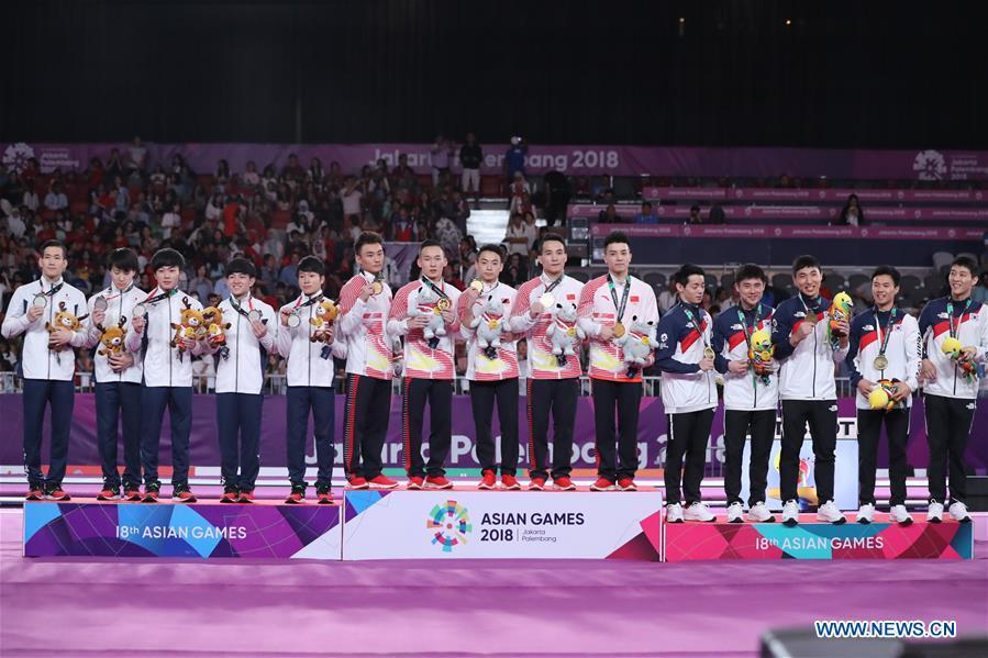 Medalists are seen during the awarding ceremony for Artistic Gymnastics Men\'s Team Final at the Asian Games 2018 in Jakarta, Indonesia on Aug. 22, 2018. (Xinhua/Zhu Wei)