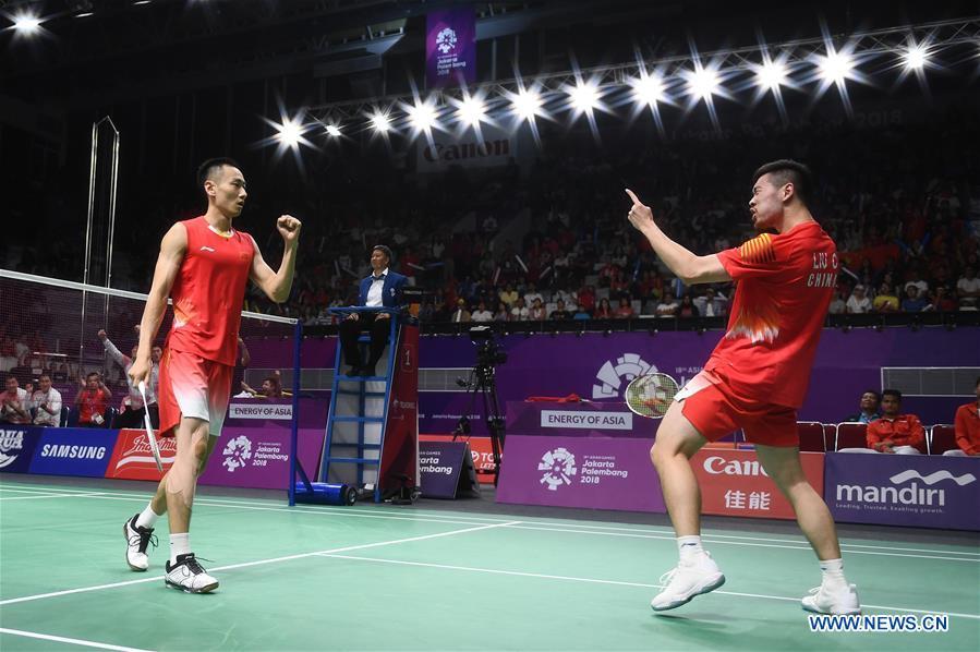 China\'s Zhang Nan (L) and Liu Cheng celebrate during the double\'s match of men\'s team final between China and Indonesia at the 18th Asian Games in Jakarta, Indonesia on Aug. 22, 2018. (Xinhua/Li Xiang)