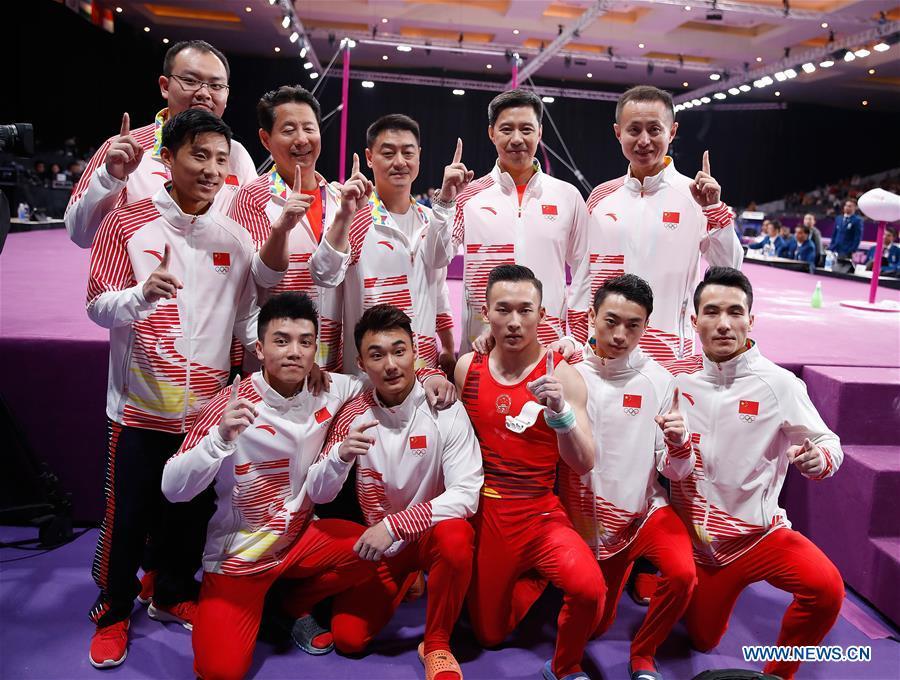 Team members of China celebrate after the Artistic Gymnastics Men\'s Team Final at the Asian Games 2018 in Jakarta, Indonesia on Aug. 22, 2018. (Xinhua/Wang Lili)