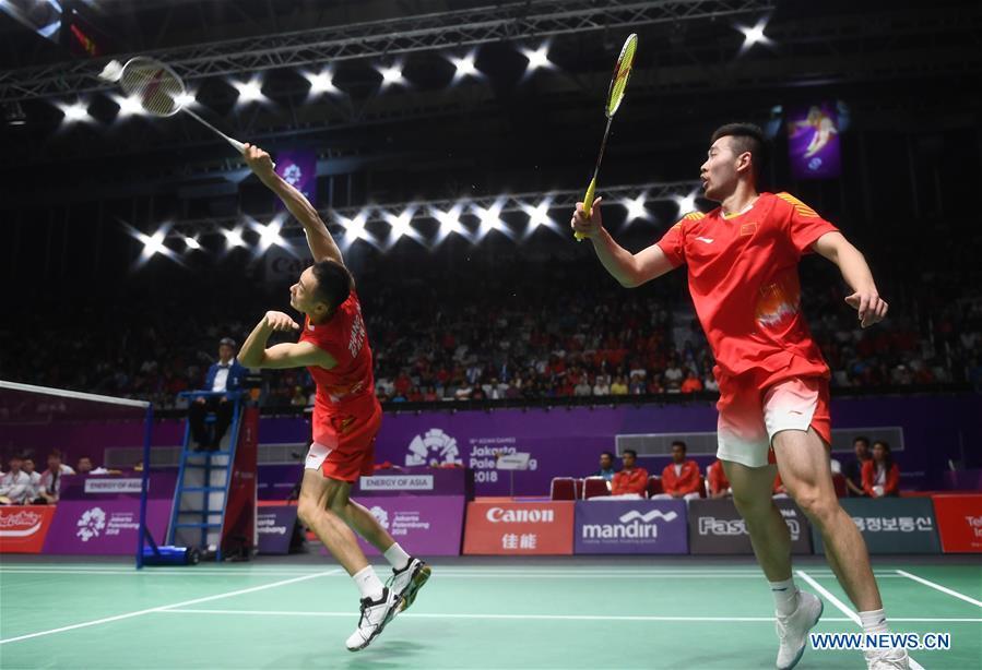 China\'s Zhang Nan (L) and Liu Cheng compete during the double\'s match of men\'s team final between China and Indonesia at the 18th Asian Games in Jakarta, Indonesia on Aug. 22, 2018. (Xinhua/Li Xiang)
