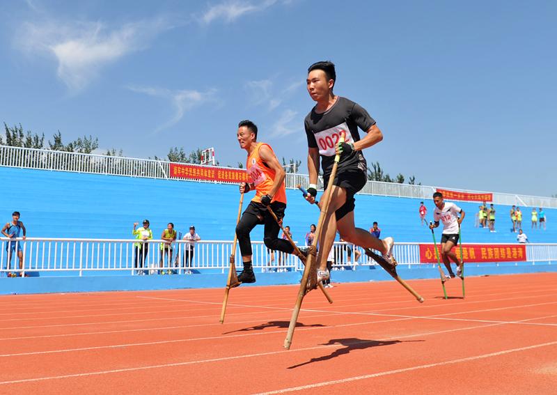 <?php echo strip_tags(addslashes(Competitors are race walking on stilts at the 10th Provincial Traditional Ethnic Sports Games in Hebei Province, Aug. 21, 2018. (Photo by Yuan Liwei for chinadaily.com.cn))) ?>