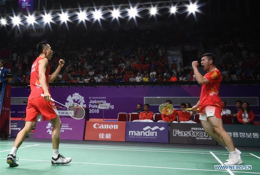 China\'s Zhang Nan (L) and Liu Cheng celebrate during the double\'s match of men\'s team final between China and Indonesia at the 18th Asian Games in Jakarta, Indonesia on Aug. 22, 2018. (Xinhua/Li Xiang)