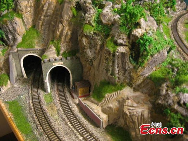 Zhang Yong’an, 63, and his family members have spent five years and more than one million yuan ($145,000) building a ‘train kingdom\' in their 330-sqm home garden in Wenjiang District, Chengdu City, Southwest China’s Sichuan Province. A great fan of train models from an early age, Zhang has tried his best to present every part of a real railway station with vivid models, including train lights, tunnels, passengers, platforms, freight trains and passenger trains. When it rains, Zhang drives all the trains indoors by remote control. (Photo: China News Service/Wu Pinghua)