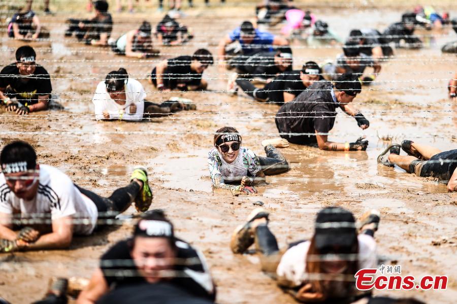 <?php echo strip_tags(addslashes(Participants compete in the 2018 Beijing Spartan Trifecta Weekend in Beijing, Aug. 26, 2018. More than 15,000 contestants participated in the obstacle course race that included three events of differing difficulty levels. (Photo: China News Service/Fu Tian))) ?>