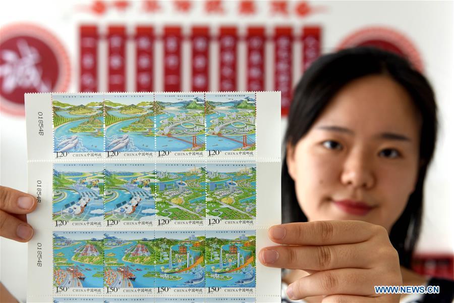 A stamp collector presents the special stamp set \