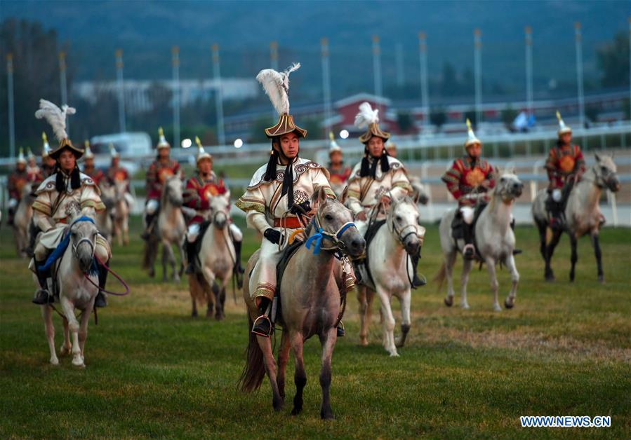 <?php echo strip_tags(addslashes(Equestrian performers attend the opening ceremony of a horse-themed art week in Hohhot, capital of north China's Inner Mongolia Autonomous Region, Aug. 27, 2018. Kicked off here on Monday, the art week will include art performances, beer and food festival, and equestrian performances. (Xinhua/Peng Yuan))) ?>