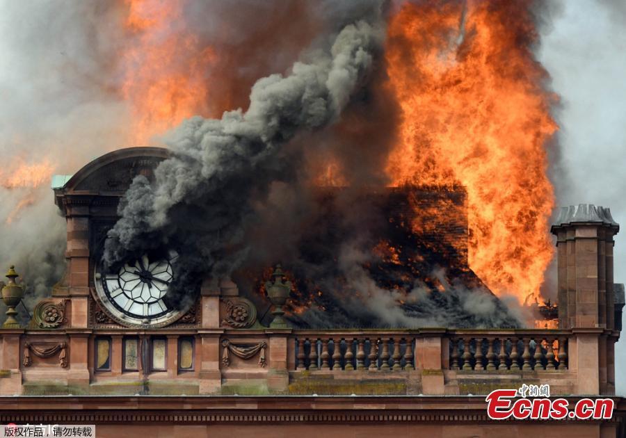 A large blaze engulfs the roof of a landmark building undergoing refurbishment in Belfast, the Northern Ireland capital, Aug. 28, 2018. The Northern Ireland Fire and Rescue Service says it was called Tuesday morning to a blaze at the Bank Buildings, home to clothing retailer Primark. Flames engulfed the roof of the structure, destroying the rooftop clock, before spreading through the five-story building. The Bank Buildings date from the late 18th century, though the current structure was built around 1900. It was nearing the end of a major renovation. (Photo/Agencies)