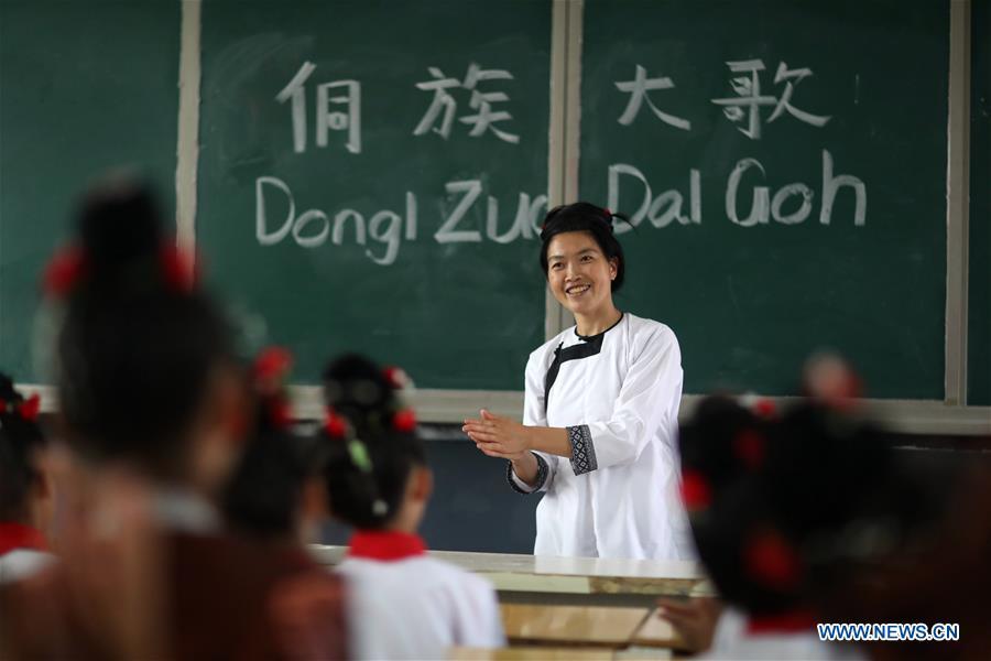 <?php echo strip_tags(addslashes(Folk artist Yang Huanzhen teaches pupils to sing songs of Kam Grand Choir, the polyphonic choir singing, at Jiali Primary School in Zaima Town of Rongjiang County, southwest China's Guizhou Province, Aug. 29, 2018. Schools in China prepared many activities for students to greet the new semester after summer vacation. (Xinhua/Yang Chengli))) ?>