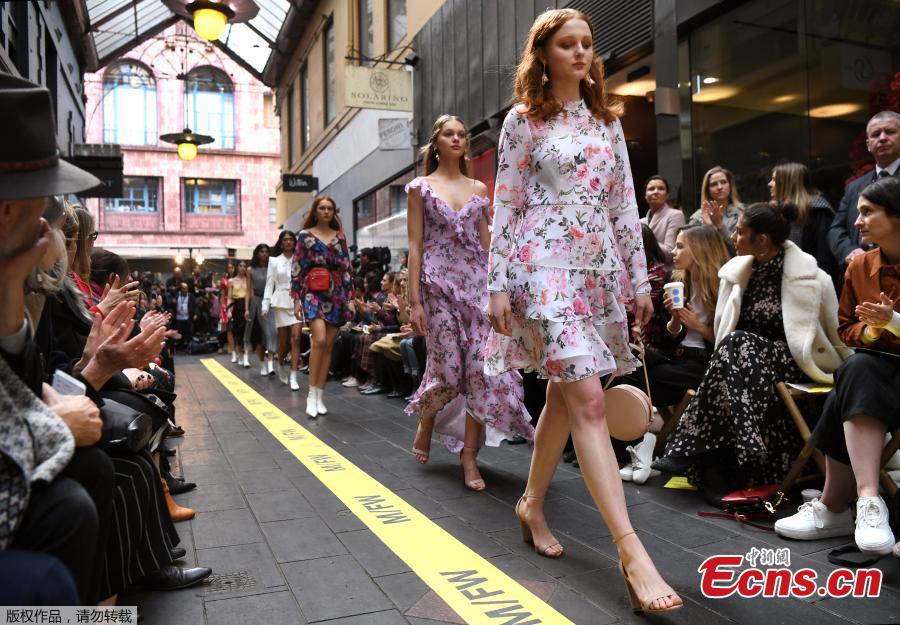 Models present the outfits on a commercial street at the Melbourne Fashion Week in Melbourne, Australia, Aug. 31, 2018. (Photo/Agencies)