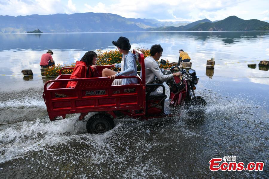 Water overflows the shores of Lugu Lake, a tourist attraction in Ninglang Yi Autonomous County, Southwest China’s Yunnan Province, Sept. 2, 2018. Local authorities have increased efforts to release more water from the lake following days of heavy rain. (Photo: China News Service/Ren Dong)