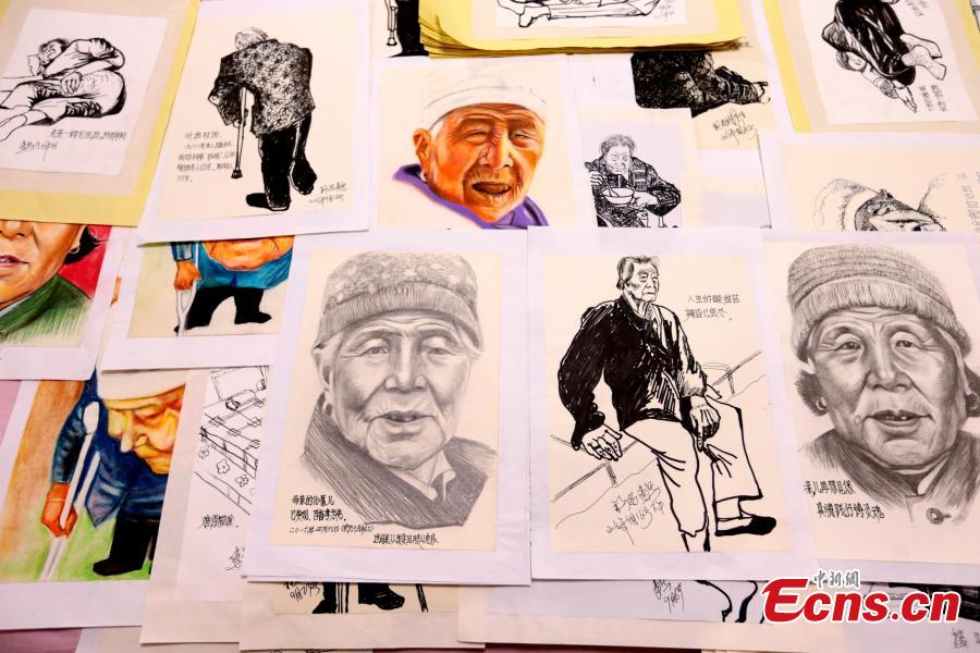 Li Fuchang shows drawings of his mother in Xi’an City, Northwest China’s Shaanxi Province, Sept. 4, 2018. Li, 60, drew more than 200 portraits of his mother before she died two years ago after becoming ill and bed-ridden. Li said he created the images to help cheer up his mother and today he feels grateful to have the record of her last days. (Photo: China News Service/Zhang Yuan)