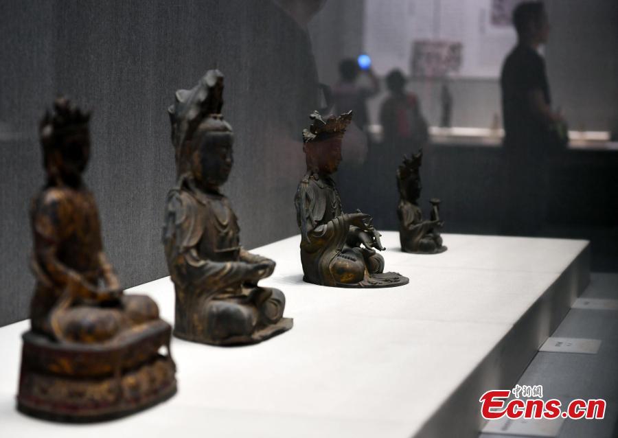 An exhibition of bronze Buddha statues opens in Shijiazhuang City, North China’s Hebei Province, Sept. 4, 2018. Hebei Provincial Museum displayed some 200 selected bronze Buddha statues made in the period from the Sixteen Kingdoms in the north (303?439) to the Qing Dynasty (1368-1644) to show the evolution of Buddhism and Buddha images in China. (Photo: China News Service/Zhai Yujia)