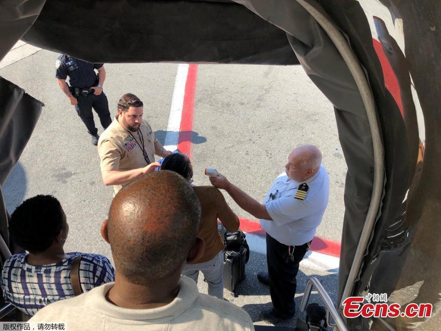 Passengers leave the plane being assisted by the air cabin crew and the emergency services on a flight from New York to Dubai, on JFK Airport, New York, U.S., September 05, 2018 in this still image obtained from social media.(Photo/Agencies)