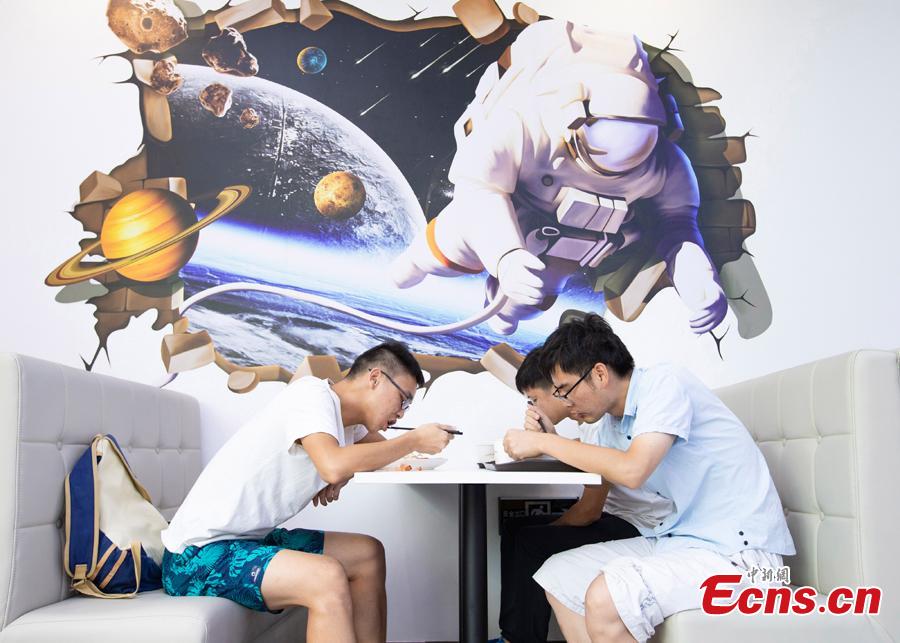 <?php echo strip_tags(addslashes(Students dine at a universe-themed canteen at Nanjing University of Aeronautics and Astronautics in Nanjing, East China's Jiangsu Province, Sept. 6, 2018. The canteen's interior decor features the Milky Way, astronauts and the Big Dipper, attracting diners to the unconventional dining space. (Photo: China News Service/Yang Bo))) ?>